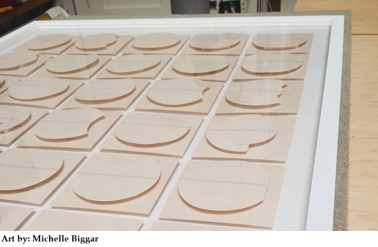 Grid of peach square panels with raised crescent shapes, creating curved shadows. (Art by Michelle Biggar)